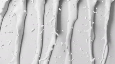 Su damlaları ve sıvı desenli beyaz süt akıntıları.