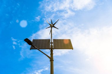 Wind turbines solar panels. Renewable photovoltaic technology with solar energy power panel and wind turbine. Solar energy panels power