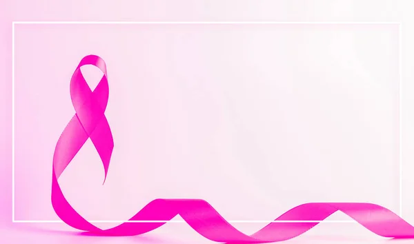 Pink ribbon background. Health care symbol pink ribbon on white background. Breast cancer woman support concept. World cancer day