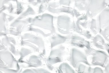 Serum dokusu, kabarcıklı şeffaf jel. Kozmetik arka plan, cilt bakım ürünü örneği