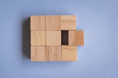 Wooden blocks on blue background, top view. Team work and problem solving concept.