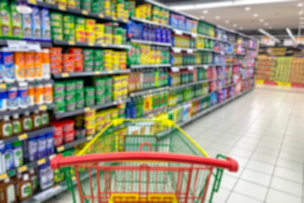 Supermercado Pasillo Con Carro Compra Vacío Desenfoque Desenfoque Para Ilustración — Foto de Stock