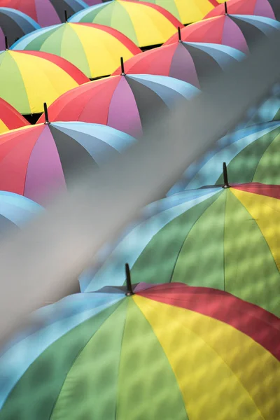Rainbow color umbrellas. Top view. Colorful background concept.
