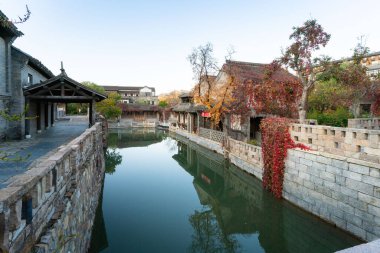 Beijing, China - Oct 23rd, 2024: Scenic view of Gubei Water Town in the morning. A famous travel destination. clipart