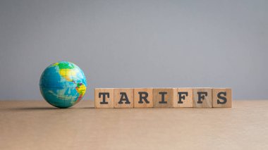 Mesajın yanındaki minyatür küre, kare tahta bloklardaki gümrük tarifeleri.