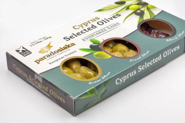 Kyiv, Ukraine - June 02, 2021: Studio shoot of Fly on Board Cyprus Selected traditional whole green, black and mixed marinated olives package closeup against white background.