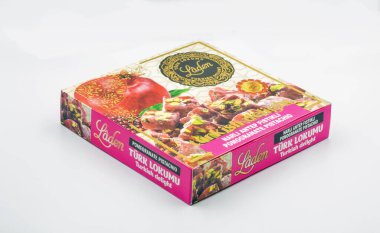 Corfu, Greece - August , 2021: Studio shoot of Laden Turkish delight lokumu pomegranate with pistachio package closeup on white.