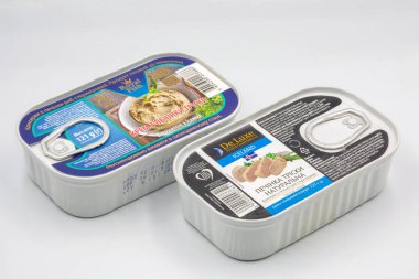 Kyiv, Ukraine - October17, 2021: Studio shoot of canned De Luxe and Royal fish Icelandic natural cod liver closeup on white background.
