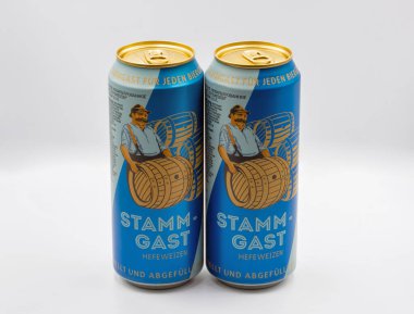 Kyiv, Ukraine - June 18, 2022: Studio shoot of German Stamm-Gast lager beer cans closeup on white.