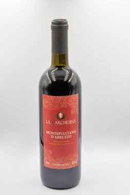 Kyiv, Ukraine - October 02, 2021: Studio shoot of La Marchesina Montepulciano DAbruzzo Italian red dry wine bottle closeup against white background.