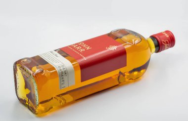 Kyiv, Ukraine - May 26, 2022: Studio shoot of John Barr blended Scotch Whisky bottle against white. It is a brand of Whyte and Mackay company producing alcoholic beverages.