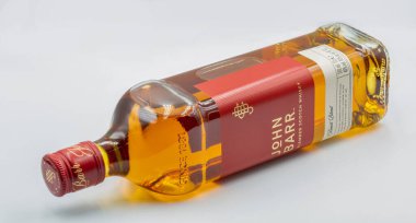 Kyiv, Ukraine - May 26, 2022: Studio shoot of John Barr blended Scotch Whisky bottle against white. It is a brand of Whyte and Mackay company producing alcoholic beverages.