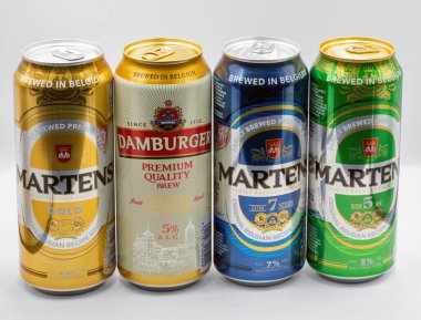 Kyiv, Ukraine - June 18, 2022: Studio shoot of different Belgium premium beer cans closeup against white.