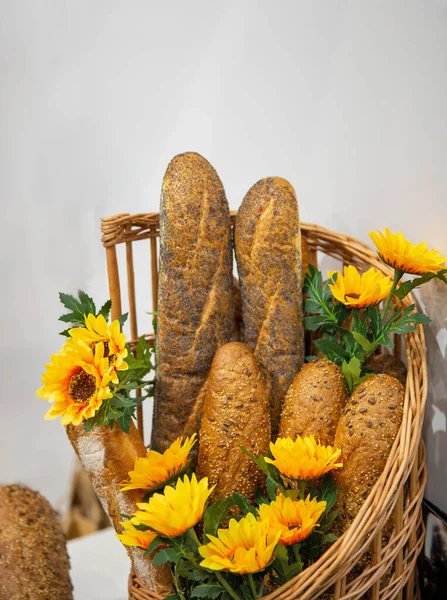 Composition Freshly Baked Bread Yellow Flowers Wicker Wooden Basket Closeup — Stock Photo, Image