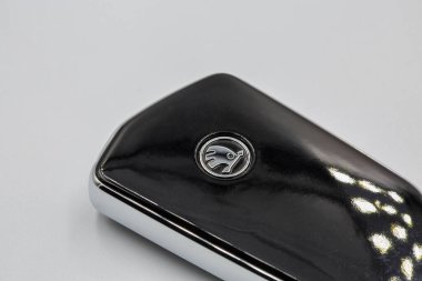 Kyiv, Ukraine - March 29, 2024: Skoda Octavia A8 modern remote car key closeup on white. Skoda Octavia is a family car produced by the Czech manufacturer since the end of 1996. clipart