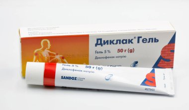 Kyiv, Ukraine - December 18, 2023: Sandoz Diclac gel tube closeup against white background. It is a topical anti-inflammatory gel, contains diclofenac and is used to relieve pain and swelling. clipart