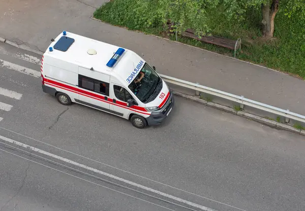 stock image Municipal ambulance car on a street in a city park, top view.