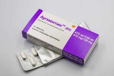 Kyiv, Ukraine - October 04, 2024: Studio shoot of Augmentin amoxicillin and clauvalanic acid tablets box by GSK closeup on white. It is an antibiotic, used to treat different bacterial infections. clipart