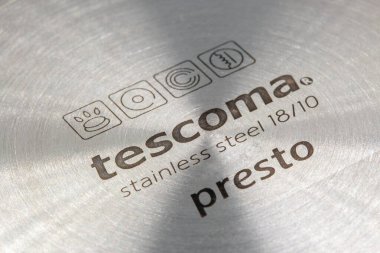 Kyiv, Ukraine - August 16, 2024: Studio shoot of Tescoma Presto stainless steel empty logo on saucepan closeup. Tescoma is a Czech manufacturer of kitchen utensils, operates in 130 countries. clipart