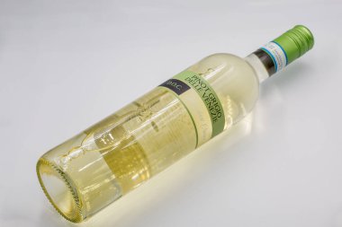 Kyiv, Ukraine - June 15, 2024 Studio shoot of Delle Venezie Pinot Grigio DOC Italian white dry wine bottle closeup against white background. clipart