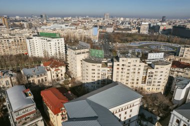 Aerial drone view over Bucharest city, Romania. Union park with fountains and Bulevardul Unirii. clipart