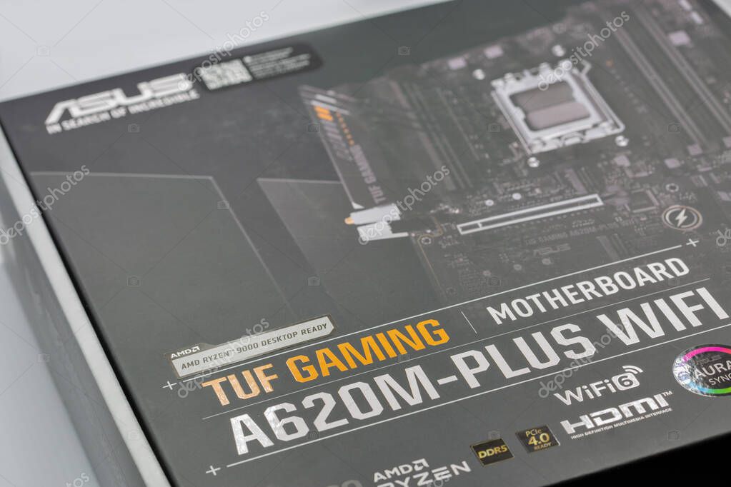 Kyiv, Ukraine - February 02, 2025: ASUS TUF Gaming motherboard package closeup on white. ASUS is a Taiwanese multinational computer, phone hardware and electronics manufacturer.