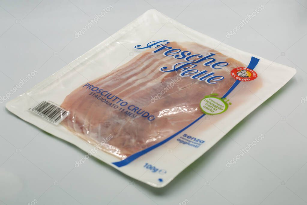 Porec, Croatia - May 20, 2025: Fresche Fette vacuum sealed package of thinly sliced raw cured ham with Italian branding, barcode, and product labeling closeup on white background.