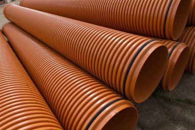 Industrial pipes for sewage and water line or driving underground. Something wet by rain  clipart