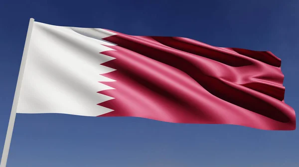 Katar 'ın ulusal bayrağı mavi gökyüzüne karşı rüzgarda dalgalanıyor..