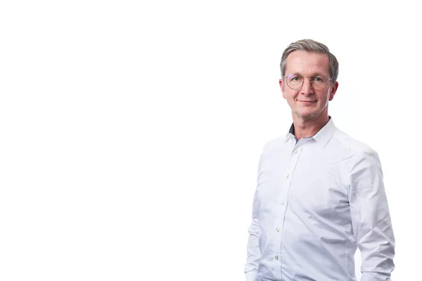 Smiling businessman portrait. Successful business man wearing dark suit while standing against at isolated white background.