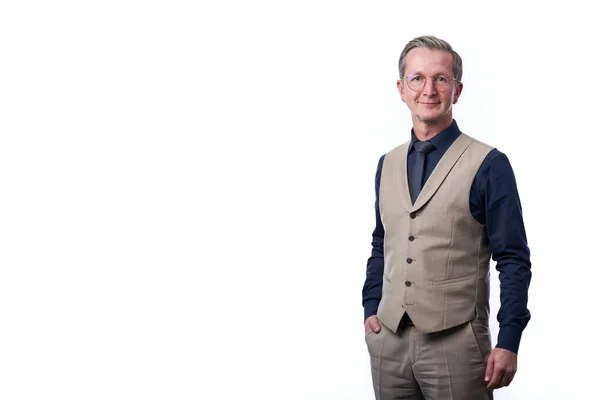 Smiling businessman portrait. Successful business man wearing light suit while standing against at isolated white background.