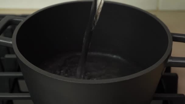 Woman Adding Water Pot Boil Domestic Kitchen — Stock Video