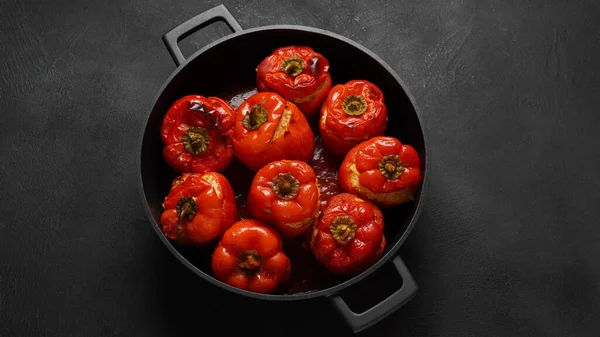 stock image Stuffed red bell peppers with beef meat and rice.