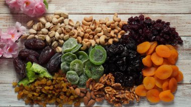 Assorted dry fruits: Dry plum, kiwi, raisins, nuts, pistachios. Tu BiShvat  a Jewish holiday concept