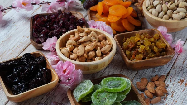 Assorted dry fruits: Dry plum, kiwi, raisins, nuts, pistachios. Tu BiShvat  a Jewish holiday concept