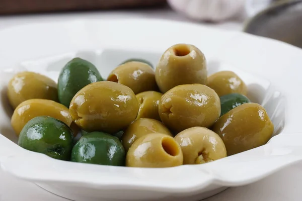 Colorful Olives in white plate ready for dinner