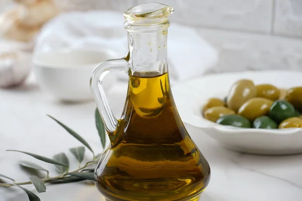 Olive oil and Olives, olive branch , on background