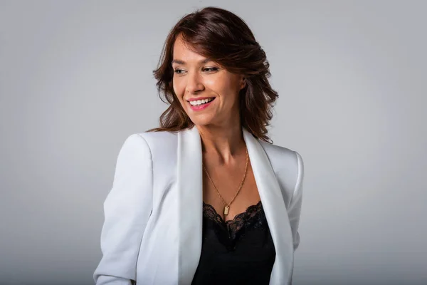 Close Attractive Middle Aged Woman Toothy Smile Wearing Blazer Isolated — Stockfoto