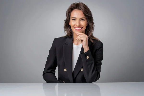 Portrait Attractive Businesswoman Wearing Black Blazer While Sitting Isolated Background — стоковое фото