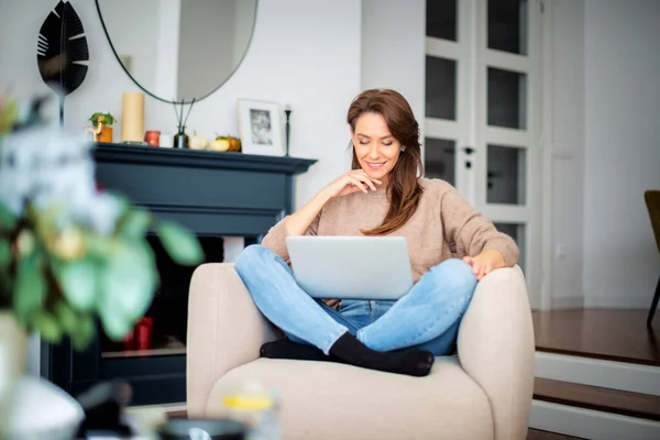 Shot Attractive Middle Aged Woman Sitting Armchair While Using Laptop — Stockfoto