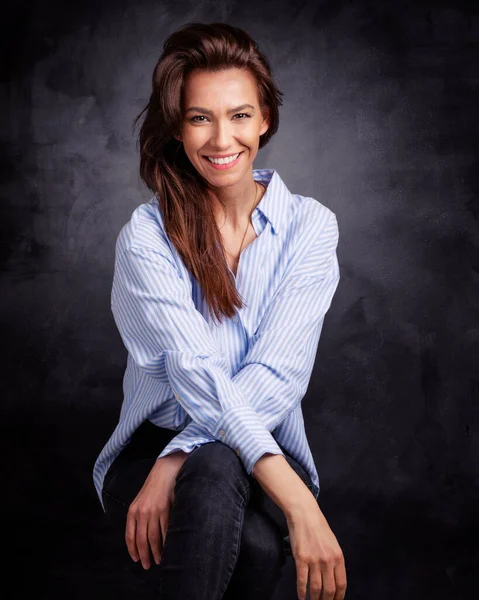 Studio Portrait Attractive Woman Wearing Shirt Laughing While Sitting Isolated — Stock Photo, Image