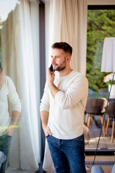 Shot Handsome Man Standing Window Home Confident Man Making Call — Stock Photo, Image