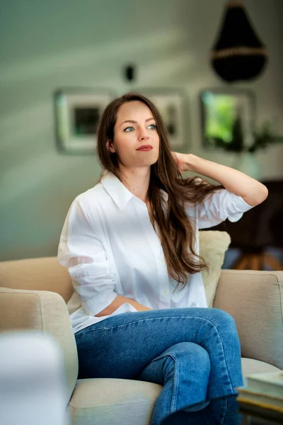 Beautiful Long Haired Woman Wearing White Shirt Relaxing Armchair Home — Stock fotografie