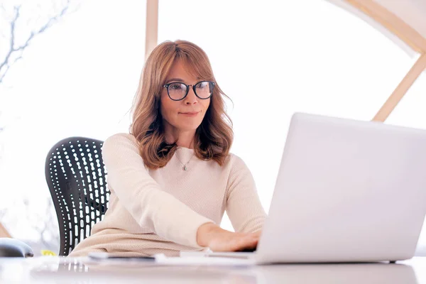 Shot Mid Aged Businesswoman Sitting Office Her Laptop Working Attractive — Stock Photo, Image