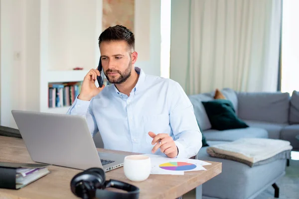 Thinking Businessman Working Home While Sitting His Laptop Having Call Royalty Free Stock Photos