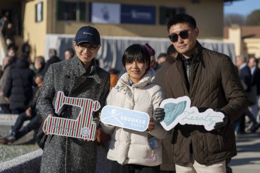 Florence, Italy - Jan 14 2025: Pitti Uomo 2025, is the largest men's fashion event in the world, most of the public goes to show off their look and style, trying to be photographed clipart