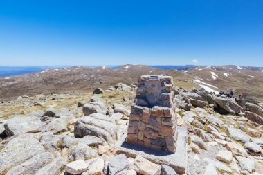 A spectacular view around the Cairn at the summit of Mt Kosciuszko on a clear summers day, in the Snowy Mountains, New South Wales, Australia