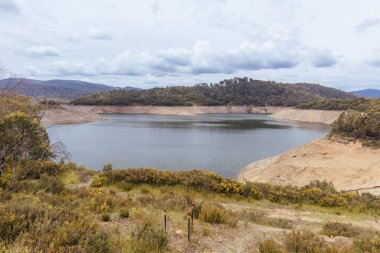 Tooma Dam from the Tooma River forming as part of the Snowy Mountains Hydro Electric power scheme in New South Wales, Australia