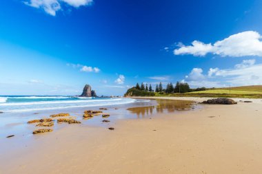 An aerial shot in late summer afternoon of Glasshouse Rocks Beach near Narooma, NSW, Australia