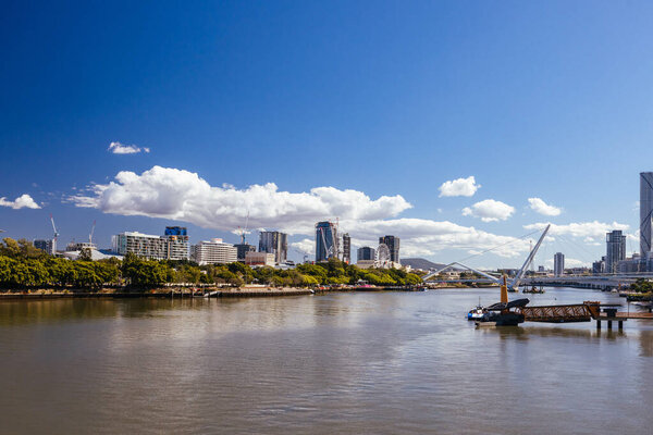 BRISBANE, AUSTRALIA - JULY 29 2023: Southbank view along the Brisbane River from Goodwill Bridge in Brisbane, Queensland, Australia